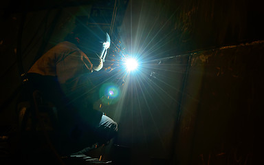 Image showing Woman worker welding  