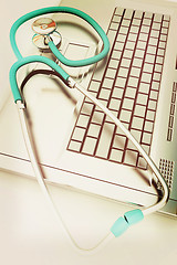 Image showing silver laptop diagnosis with stethoscope. 3D illustration. Vinta