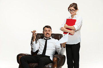 Image showing The young man and beautiful woman in business suit at office on white background