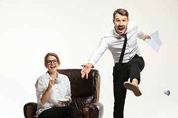 Image showing The young man and beautiful woman in business suit at office on white background