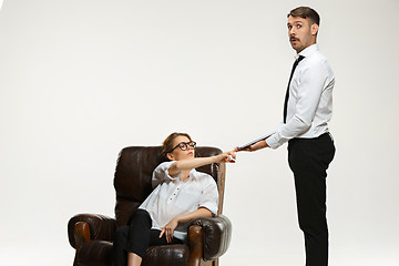 Image showing The young man and beautiful woman in business suit at office on white background