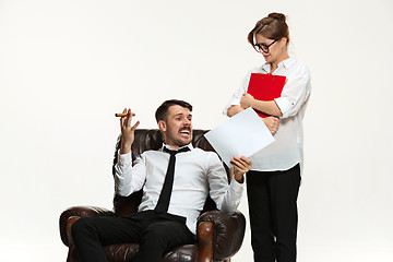 Image showing The young man and beautiful woman in business suit at office on white background