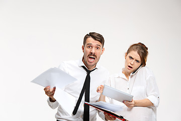 Image showing The business man and woman communicating on a gray background