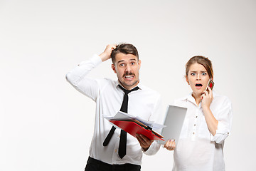 Image showing The business man and woman communicating on a gray background