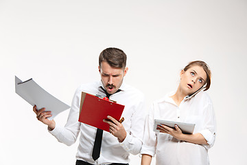 Image showing The business man and woman communicating on a gray background