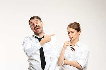 Image showing The young man and beautiful woman in business suit at office on white background