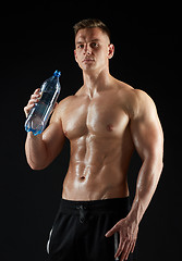 Image showing young man or bodybuilder with bottle of water