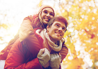 Image showing happy young couple having fun in autumn park