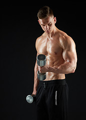 Image showing man with dumbbells exercising