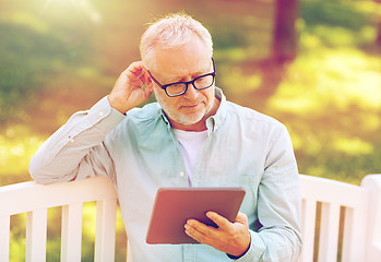 Image showing senior man with tablet pc at summer park