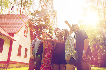 Image showing friends taking selfie at party in summer garden