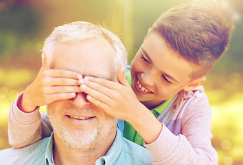 Image showing grandfather and grandson playing at summer park