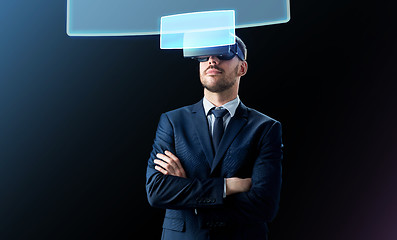 Image showing businessman in virtual reality headset over black