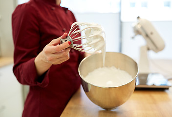 Image showing chef with whisk and whipped egg whites at kitchen