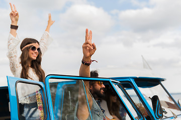 Image showing hippie friends at minivan car showing peace sign