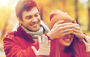 Image showing happy young couple having fun in autumn park