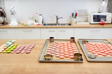 Image showing macarons on oven trays at confectionery