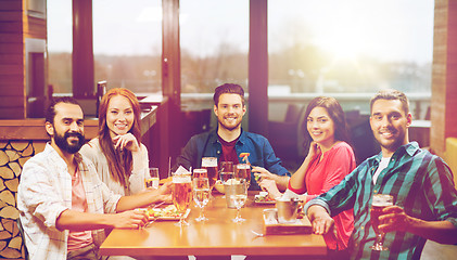 Image showing friends dining and drinking beer at restaurant