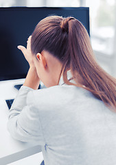 Image showing stressed woman with computer