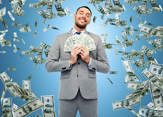 Image showing smiling businessman with american dollar money