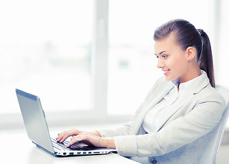 Image showing businesswoman with laptop in office