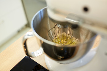 Image showing electric mixer whipping egg whites at kitchen