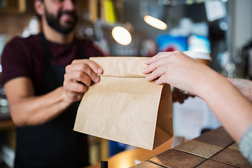 Image showing man or bartender serving customer at coffee shop