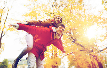 Image showing happy young couple having fun in autumn park