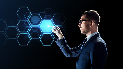 Image showing businessman working with virtual network hologram