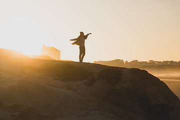 Image showing Woman over the cliff