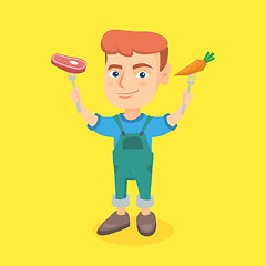 Image showing Caucasian boy holding fresh carrot and steak.