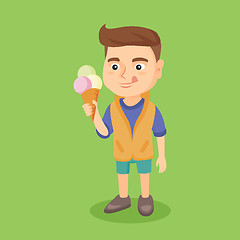 Image showing Little caucasian boy holding an ice cream cone.