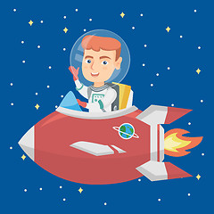 Image showing Caucasian smiling boy riding a spaceship.