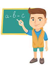 Image showing Caucasian schoolboy writing on the blackboard.