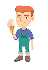 Image showing Little caucasian boy holding an ice cream cone.