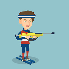 Image showing Young caucasian biathlon runner aiming at target.