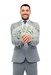 Image showing smiling businessman with american dollar money