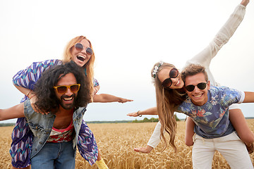 Image showing happy hippie friends having fun on cereal field