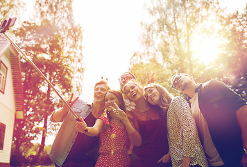 Image showing friends taking selfie at party in summer garden