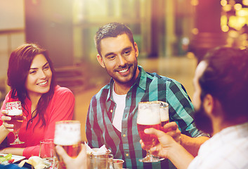 Image showing friends dining and drinking beer at restaurant