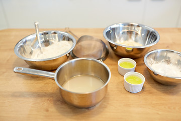 Image showing bowls with flour and egg whites at bakery kitchen