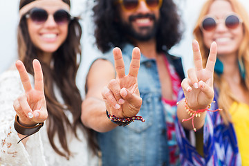 Image showing happy young hippie friends showing peace outdoors