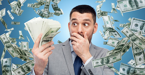 Image showing smiling businessman with american dollar money