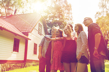 Image showing friends taking selfie at party in summer garden