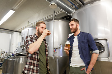 Image showing men testing non-alcoholic craft beer at brewery