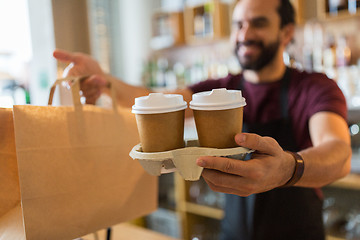 Image showing man or bartender serving customer at coffee shop