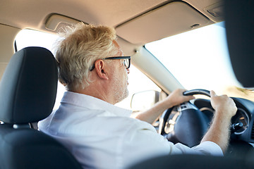 Image showing happy senior man driving car