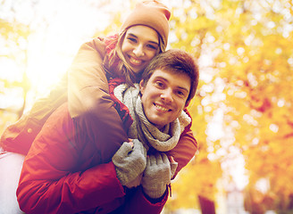 Image showing happy young couple having fun in autumn park