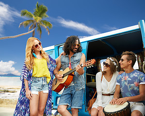 Image showing hippie friends playing music over minivan on beach