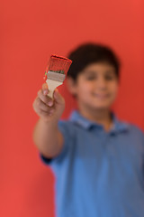 Image showing Portrait of a happy young boy painter